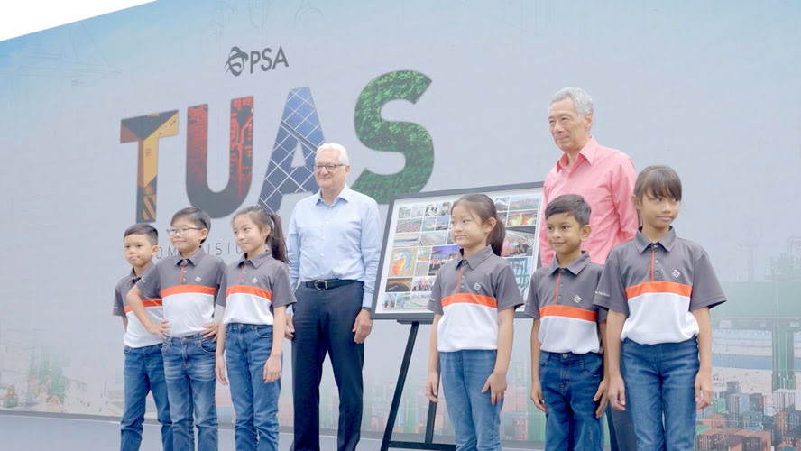Singapore's Prime Minister, PM Lee Hsien Loong, on stage with a group of children.